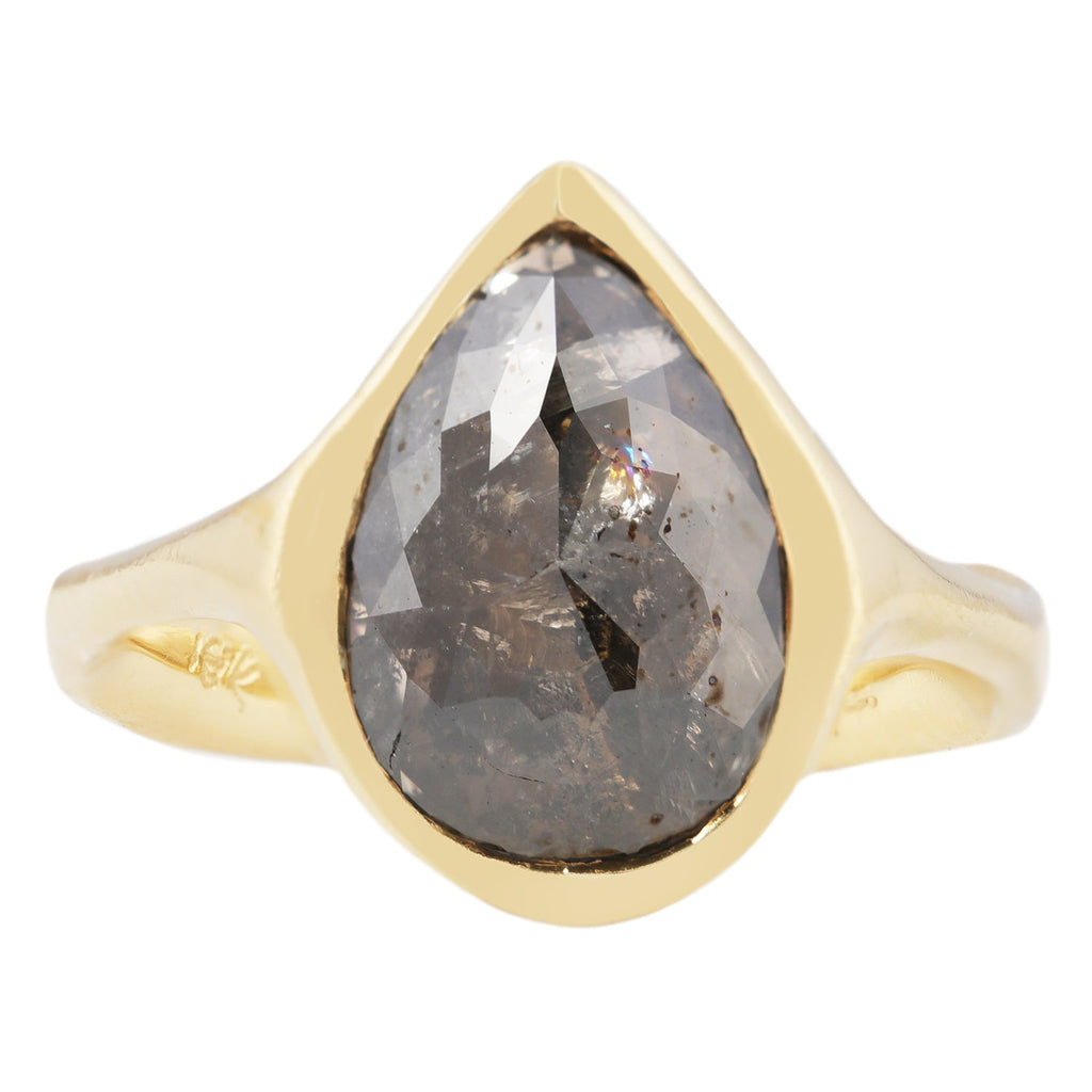 Althea Solitaire with pear shaped salt and pepper black diamond by Erin Cuff Jewelry.